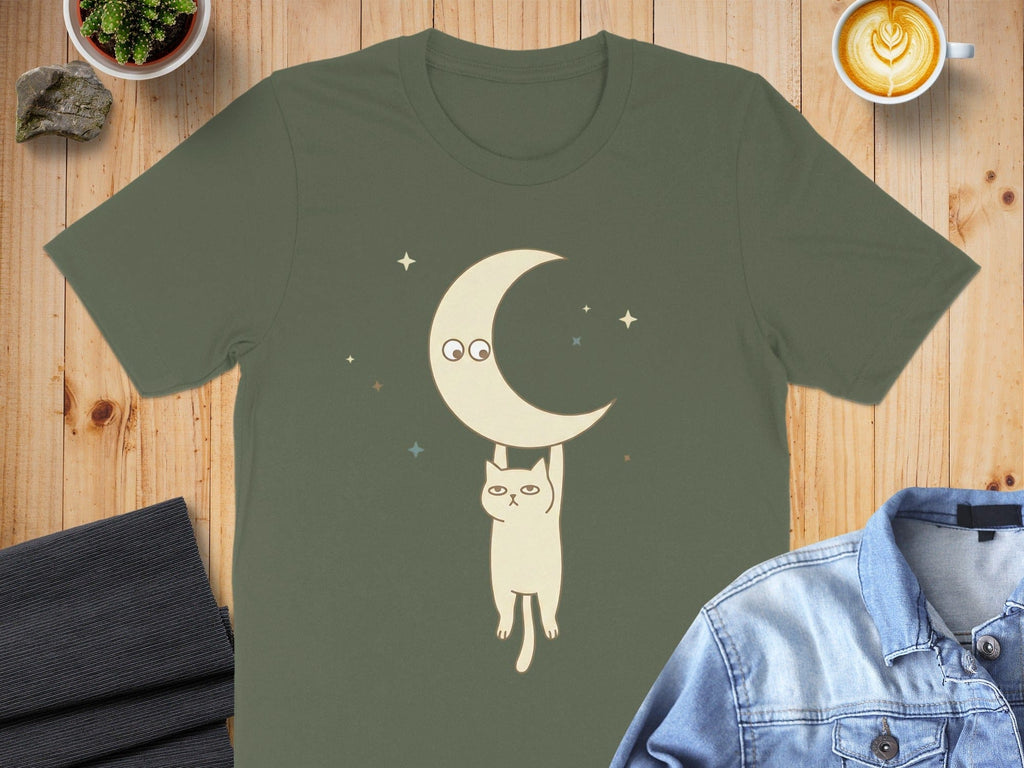 Cat Hanging from Crescent Moon Graphic T-Shirt